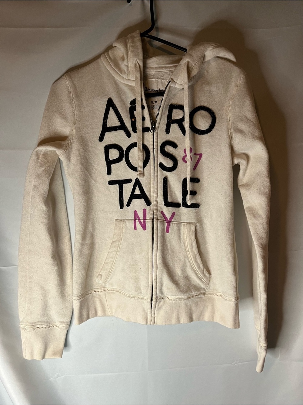 Aeropostale Cream Zip-Up Hoodie with Black Sequin Logo and Pink Accents